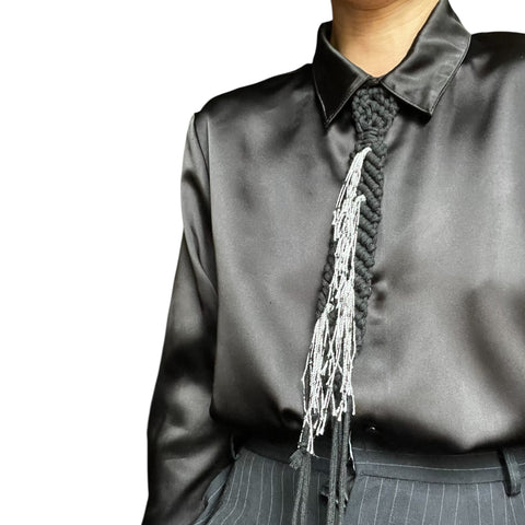 k Tie with Tassels and Buttoned Up Black Shirt